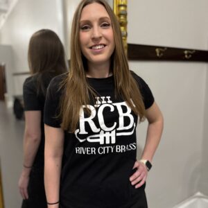 RCB Black Tee modeled by member of the band in front of a mirror